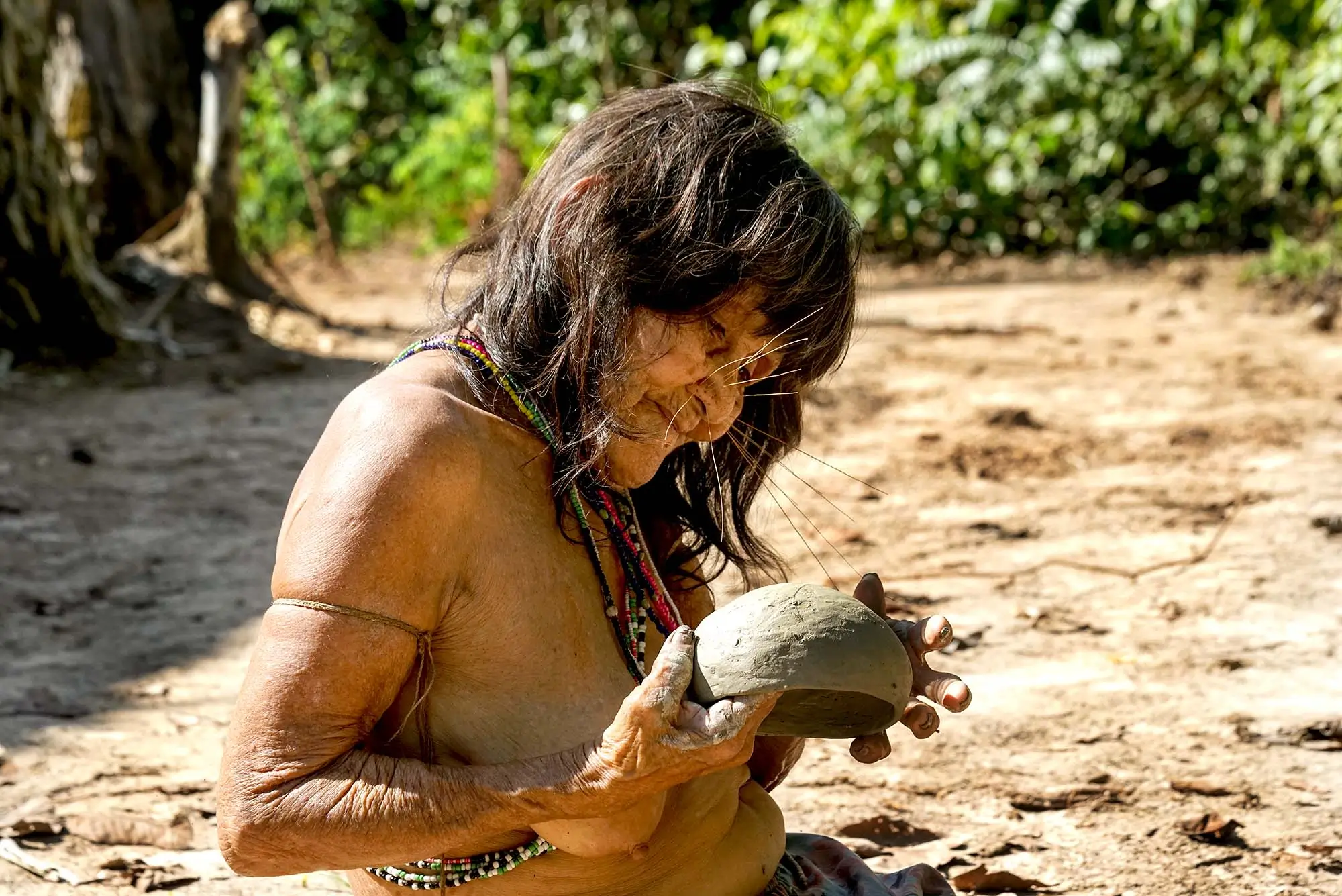 Matsés Elder Woman Crafting Traditional Handmade Clay Pottery