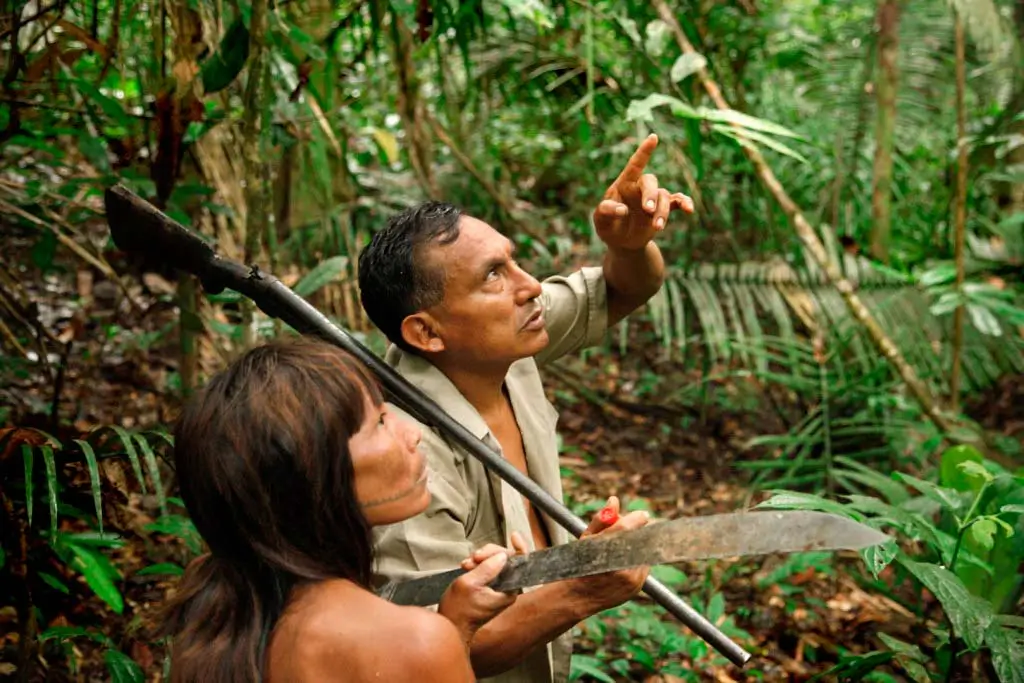 Matsés Hunter and Wife Setting Out for a Traditional Hunt in the Amazon