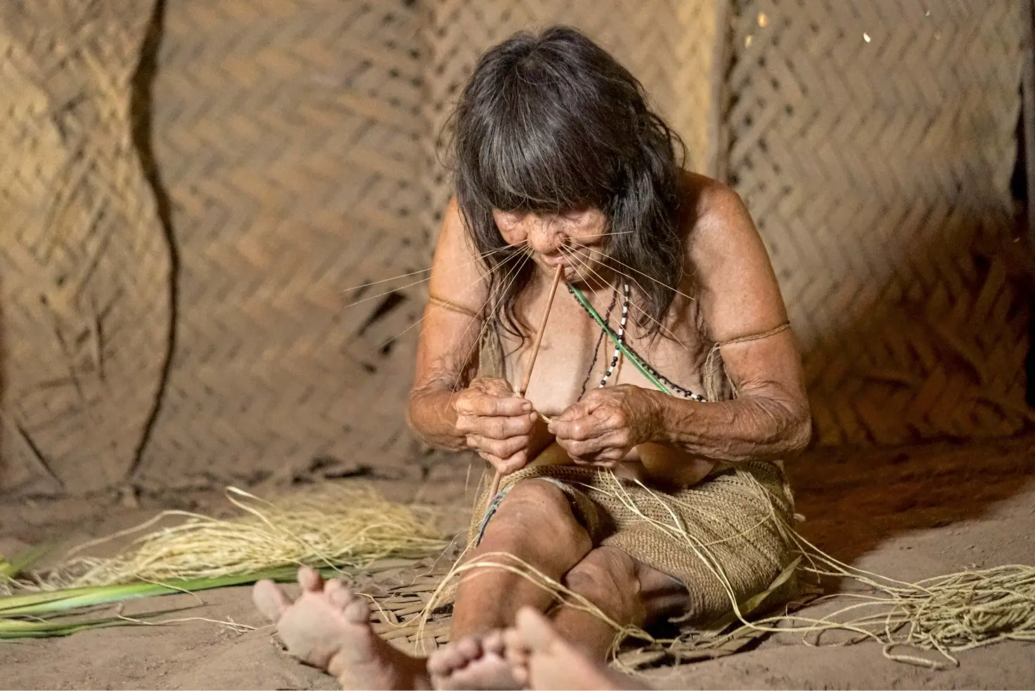 Matsés Woman Weaving Natural Fibers